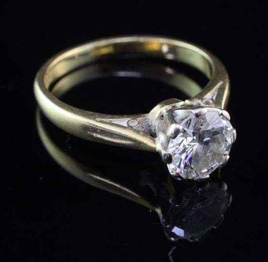 A mid 20th century 18ct gold and platinum solitaire diamond ring, size K.